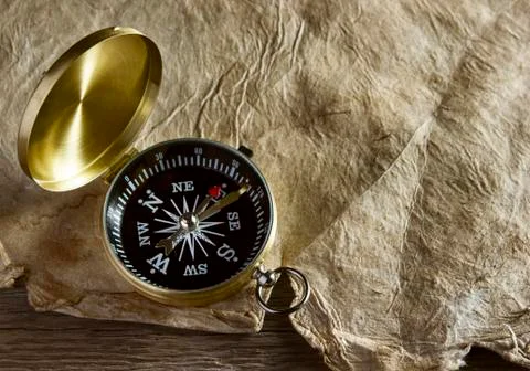 Old compass and paper Stock Photos