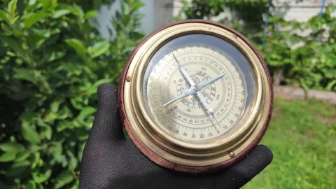 Old compass in hands. Man using compass to find location. Close-up travel c.. Stock Footage 311506408
