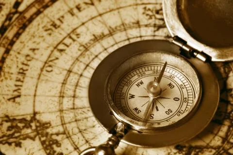 Old compass on vintage map Stock Photos
