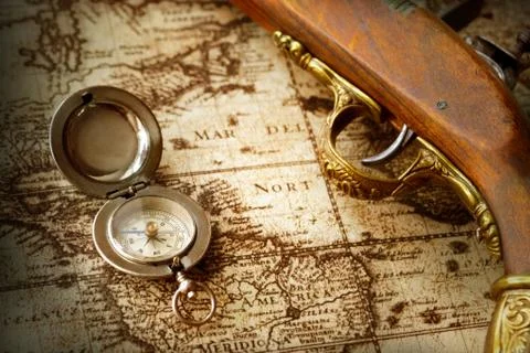Old compass on vintage map Stock Photos