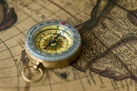 Old compass on vintage map 写真素材