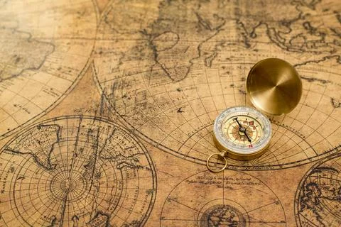 Old compass  on vintage map Stock Photos