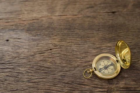 Old Compass on wood background Stock Photos