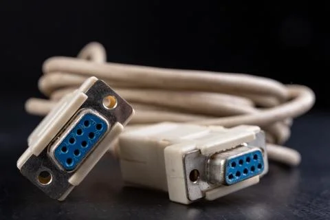 Old computer cable for transferring digital data. Computer accessories. Stock Photos