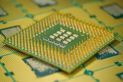 Old computer CPU close up showing pins essential for processing power Stock Photos