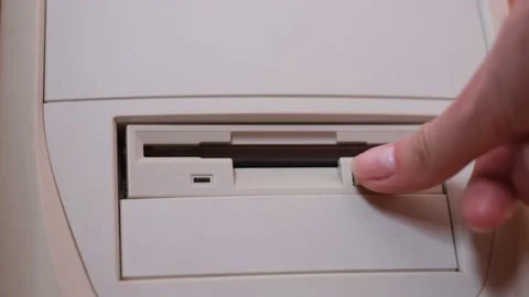 Old computer with disk drive. Shooting the process of removing a floppy disk 스톡 동영상 196791925