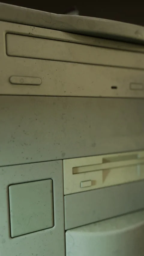 Old computer equipment and storage unit in a workspace setting Stock Footage 334885703