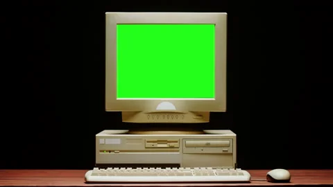 Old computer with green chroma key screen close-up, Desktop PC isolated on black Stock Footage 207139058