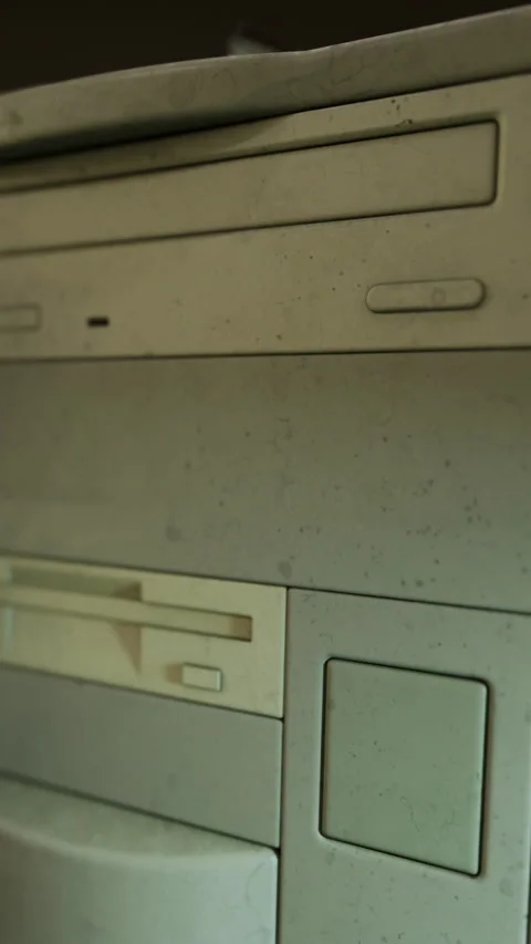 Old computer hardware on a desk in a room with low light at home Stock Footage 335233242