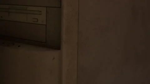 Old computer hardware sits in a dusty room with light reflecting on surfaces Stock-Footage 344379441
