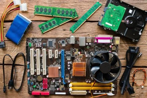 Old computer hardware on a wooden background Stock Photos