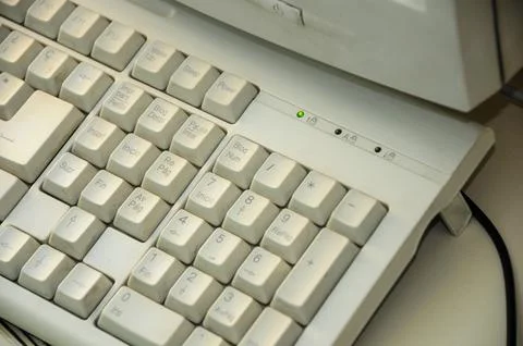 Old computer keyboard with worn keys highlighting vintage technology Fotos Stock