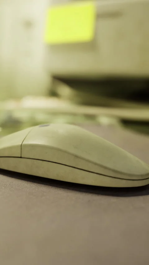 Old computer mouse sitting on desk near unusual background Stock Footage 334198273