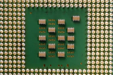 Old computer processor with gold-plated legs, microcircuits on it, top view Foto stock