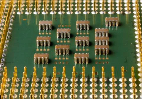 Old computer processor with gold-plated legs, microcircuits on it Stock Photos