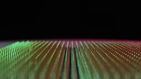 The old computer processor spins on a green background. CPU. Gold plated Stock Footage 156855371