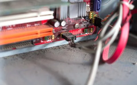 Old computer system unit with dust and spiderweb inside. Stock Photos