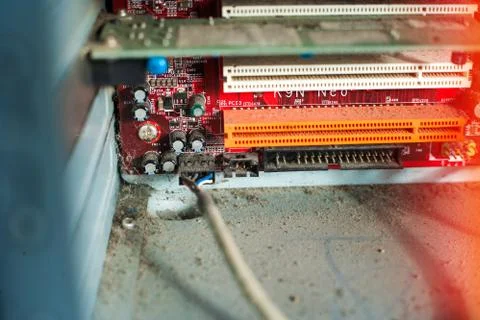 Old computer system unit with dust and spiderweb inside. Stock Photos