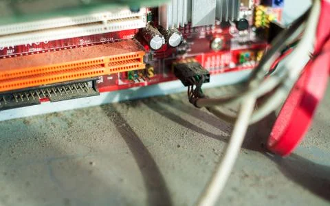 Old computer system unit with dust and spiderweb inside. Stock Photos