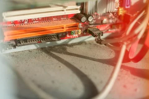 Old computer system unit with dust and spiderweb inside. Stock Photos