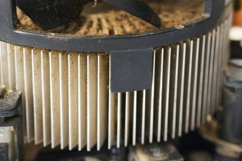 Old computer system unit with spiderweb and dust inside. Stock Photos