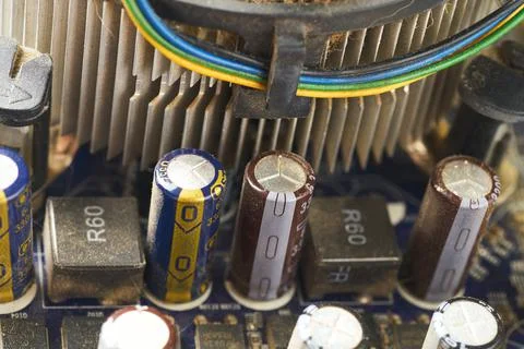 Old computer system unit with spiderweb and dust inside. Stock Photos