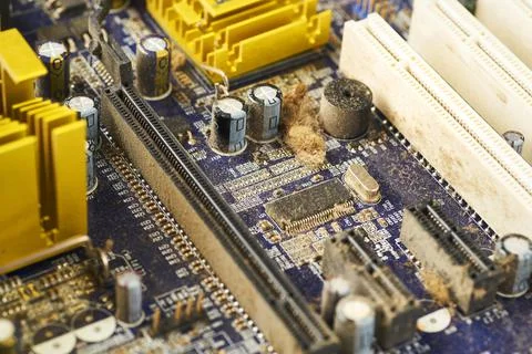 Old computer system unit with spiderweb and dust inside. Stock Photos