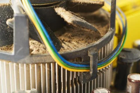 Old computer system unit with spiderweb and dust inside. Stock Photos