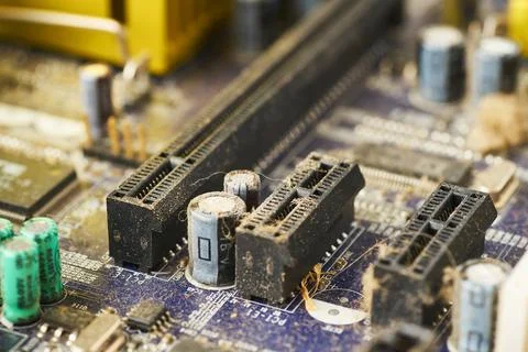 Old computer system unit with spiderweb and dust inside. Stock Photos