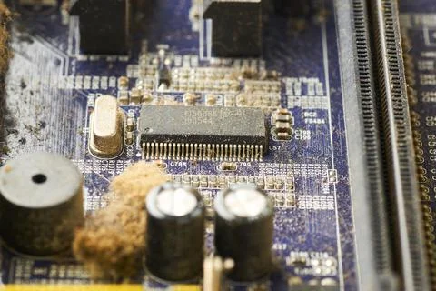 Old computer system unit with spiderweb and dust inside. Stock Photos
