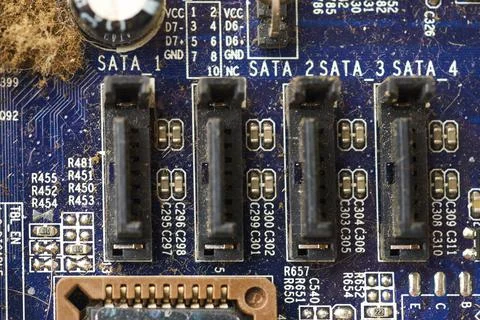 Old computer system unit with spiderweb and dust inside. Stock Photos