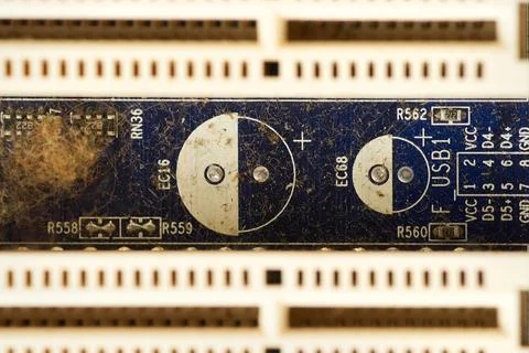 Old computer system unit with spiderweb and dust inside. Stock Photos