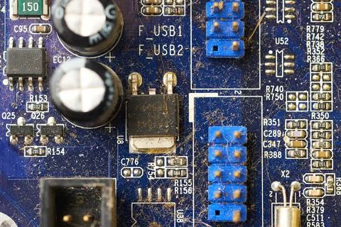 Old computer system unit with spiderweb and dust inside. Stock Photos