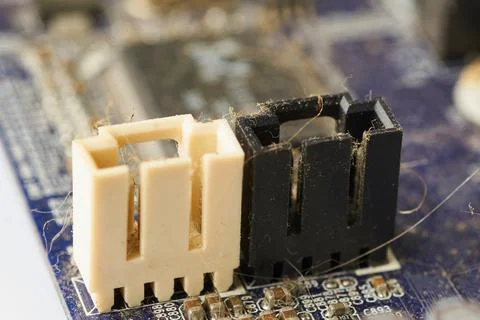 Old computer system unit with spiderweb and dust inside. Stock Photos