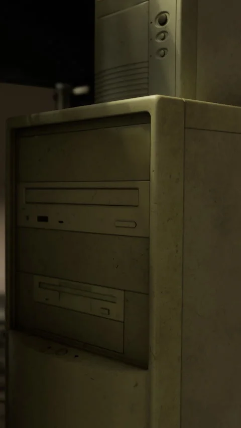 Old computer tower in a dimly lit room near a wall at night Stock Footage 335964156