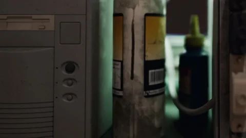 Old Computer Tower Sitting on a Desk Indoors With Various Objects Stock Footage 348396745