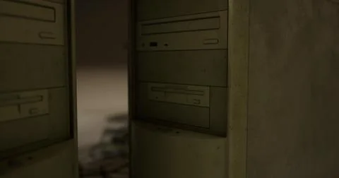 Old computer towers positioned against a blurred background in a dim room Illustrazione stock