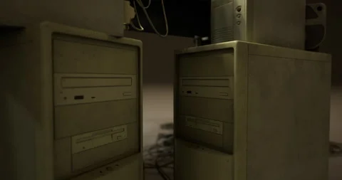 Old computer towers surrounded by dusty cables in a dimly lit room Stock Footage 306307966