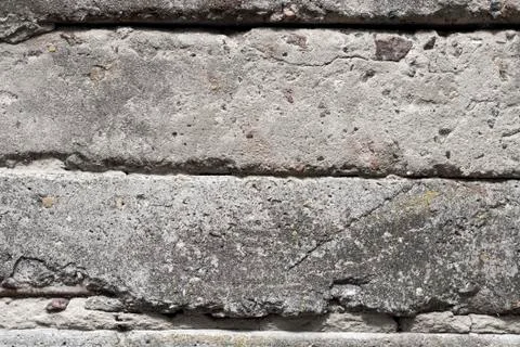 Old concrete blocks wall background closeup Stock Photos