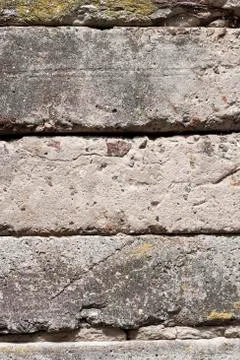 Old concrete blocks wall background closeup Stock Photos