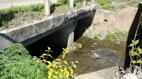 Old concrete bridge with a small stream flowing under it 動画素材 10873793