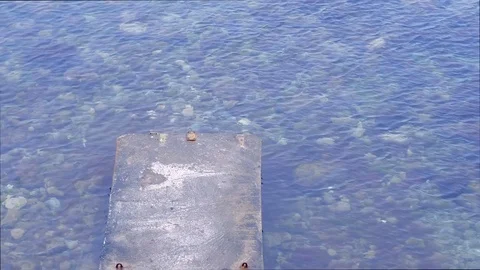 Old concrete destroyed pier at sea, transparent water with seaweeds. Stock Footage 116366307