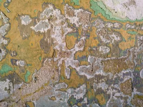 Old concrete wall background with multiple layers of peeled colors Stock Photos