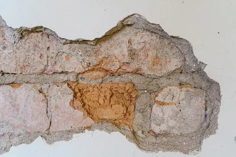 The old concrete wall cracked bricks visible for background Stock Photos
