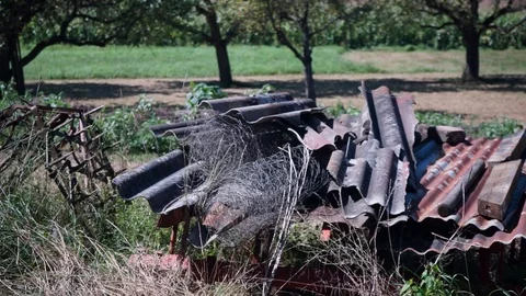 Old construction matierial on a field Stock Footage 115705099