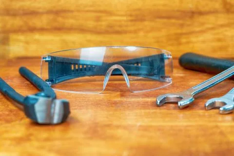 Old construction tool builder nippers and wrench with goggles Stock Photos