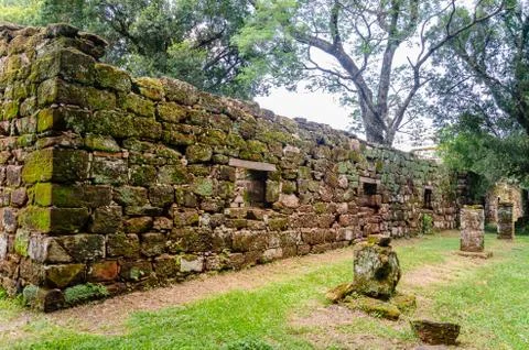 Old constructions covered with moss and full of windows and a corridor on the Stock Photos