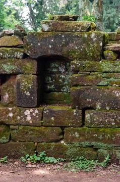 Old constructions covered with moss and a covered window on the front in San  Stock Photos