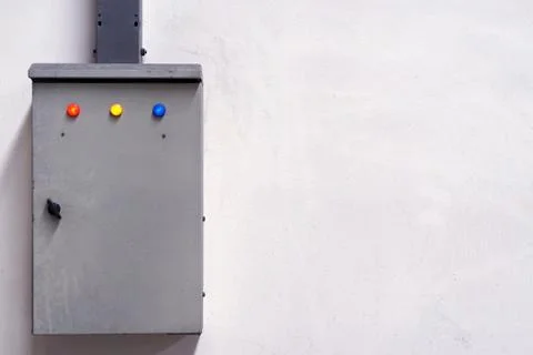 Old control box with the red yellow and blue button Stock Photos