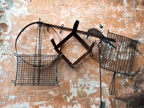 Old cooking tools on wall Stock Photos